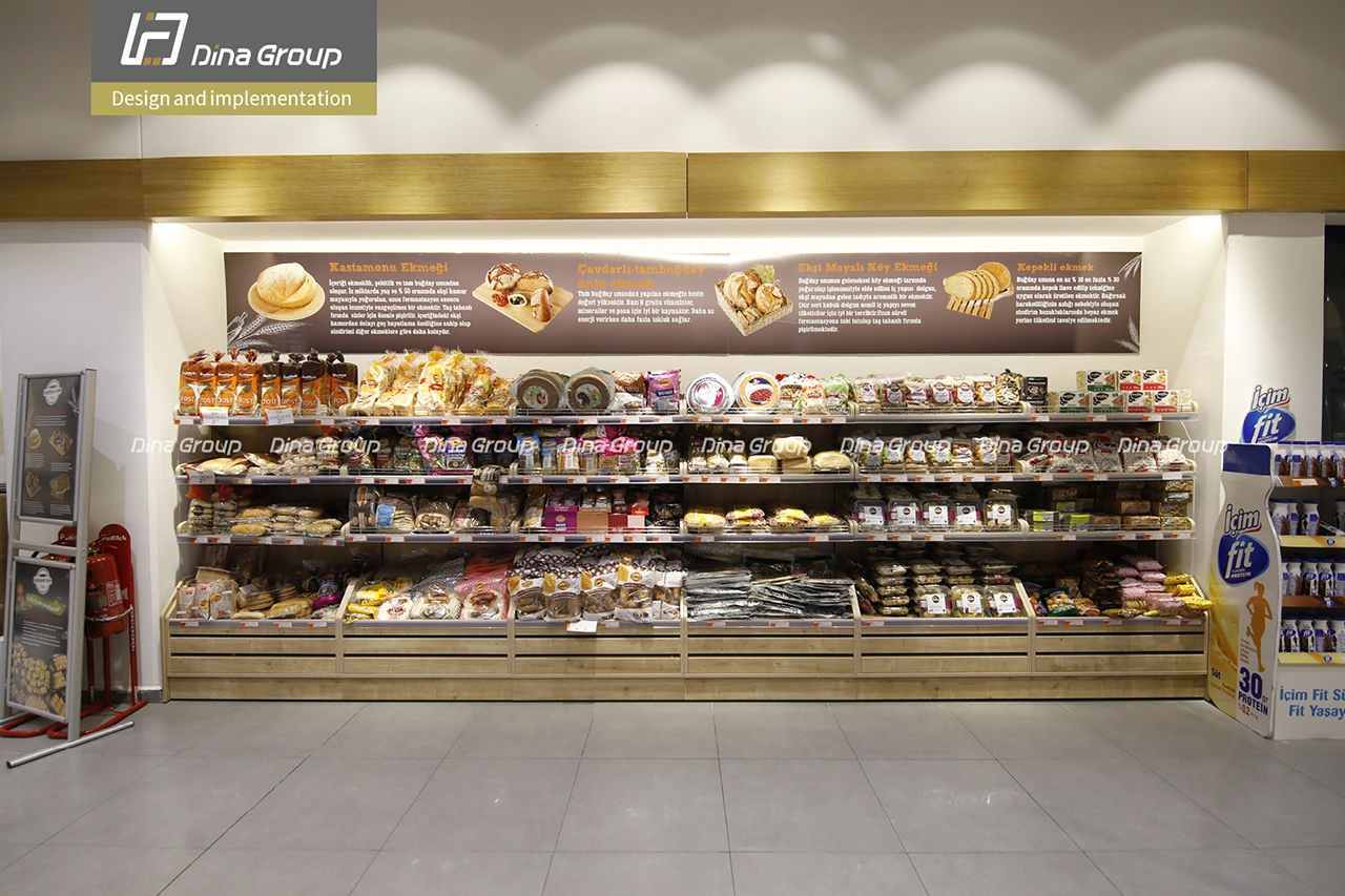 Modern bread shop design and build with wooden shelves and premium bakery display by Dina Group Modern bread shop design and build with wooden shelves and premium bakery display by Dina Group